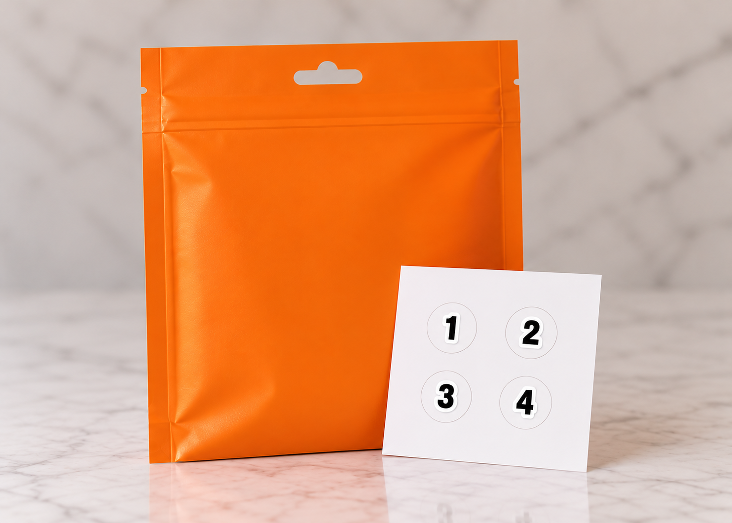 H2Otag orange packaging next to a sheet of peel-off number stickers 1, 2, 3, and 4